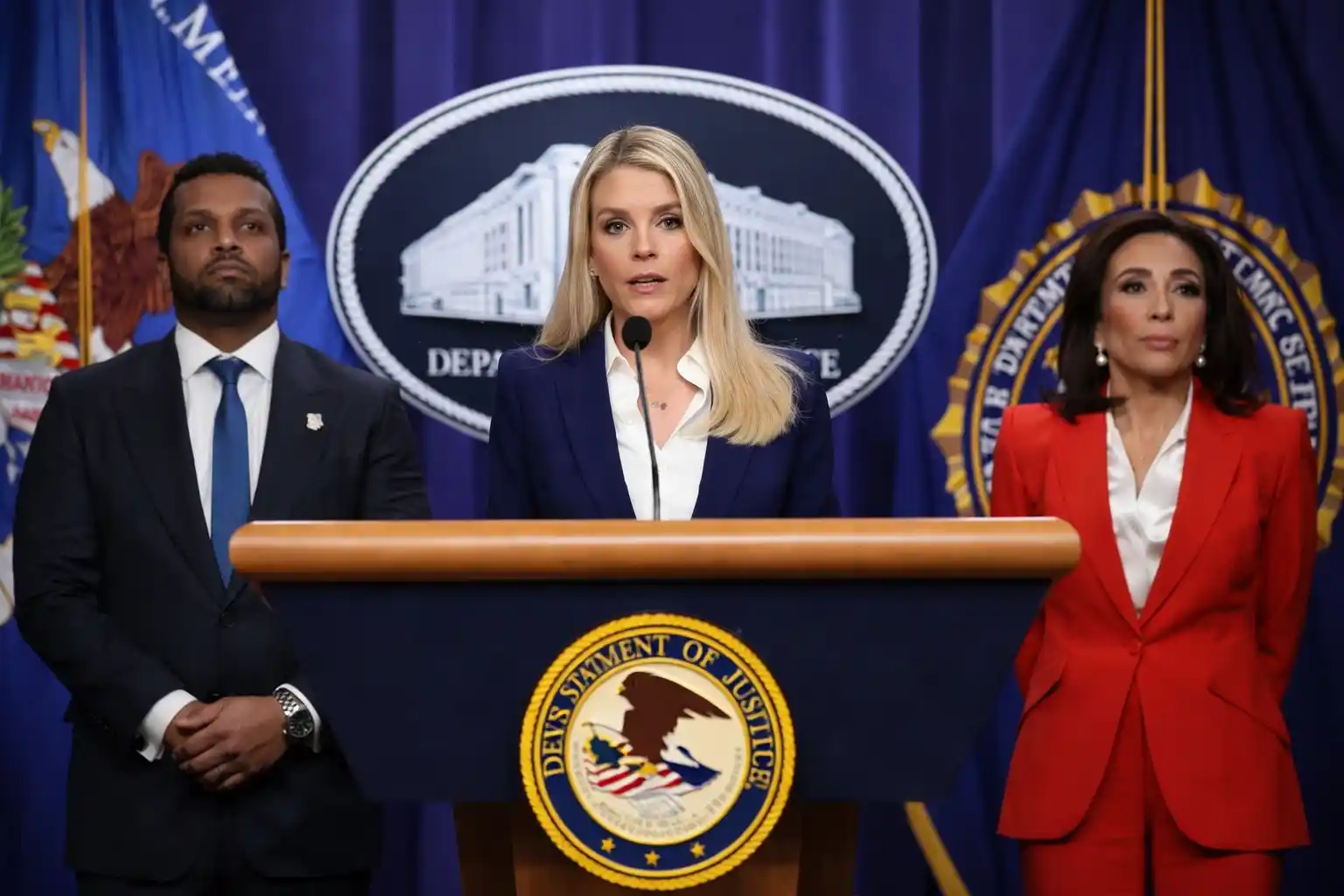 Department of Justice officials at press conference discussing Benghazi attack arrest.