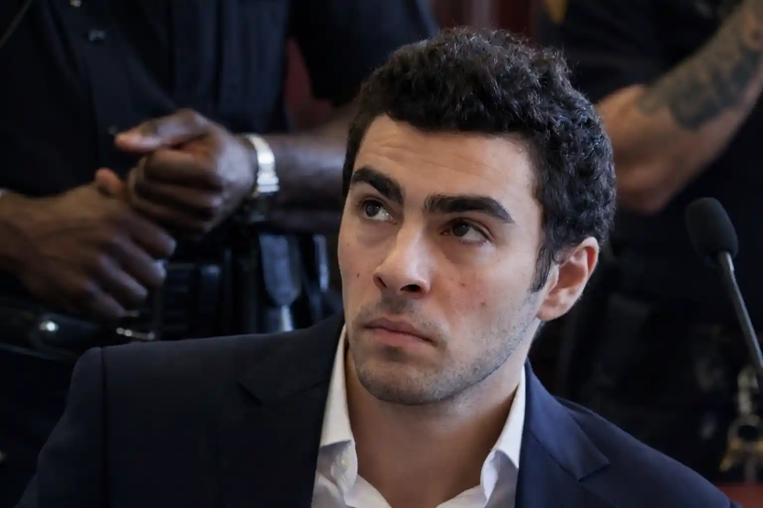 Luigi Mangione seated in court during a hearing in the UnitedHealthcare CEO murder case