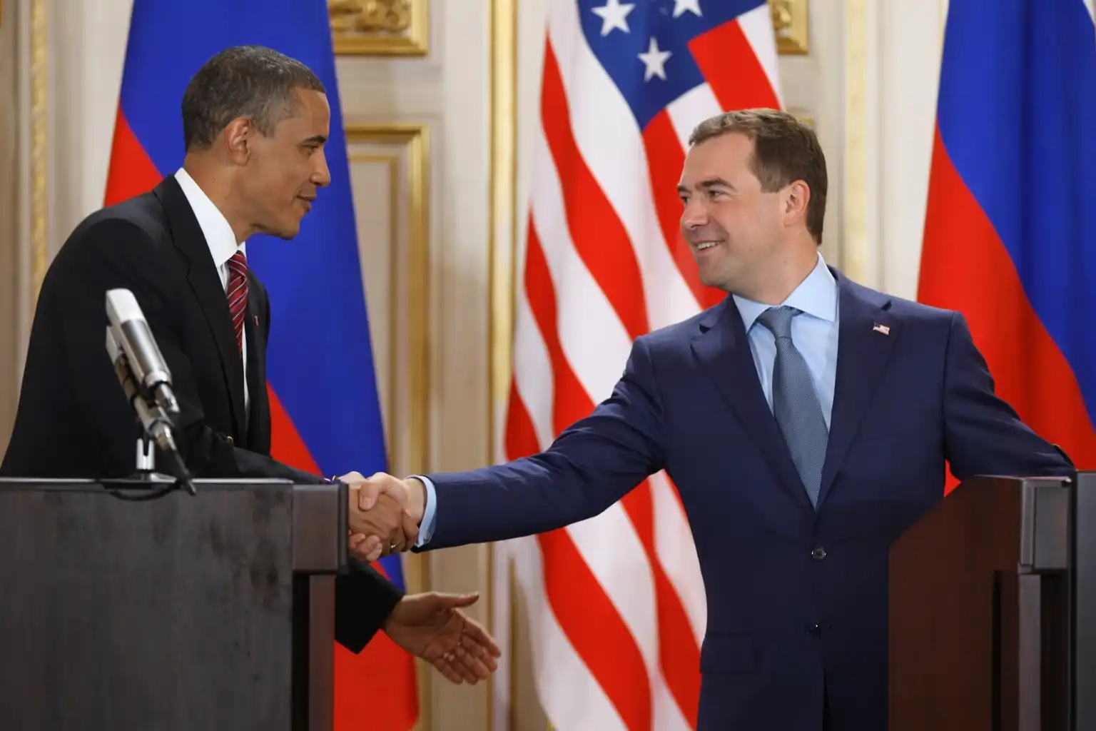 U.S. and Russian leaders shake hands during nuclear arms control talks